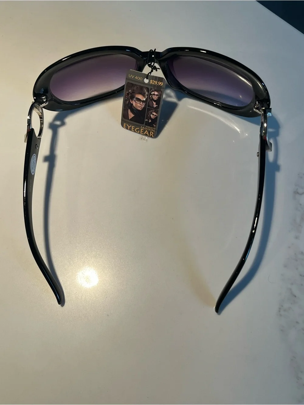 NWT fabulous oversized black sunglasses with violet lenses.